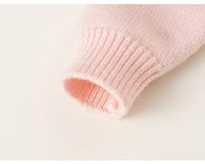 Close-up of soft pink knitted cuff showing fine ribbed texture and premium elastic fabric