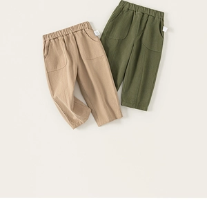 Detail view of cotton linen kids' casual trousers with elastic waist and large cargo pockets