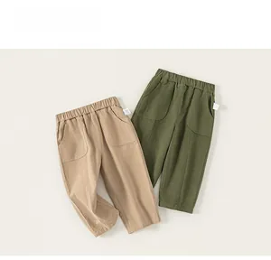 Close-up of khaki and army green children cotton pants with elastic waist and pockets