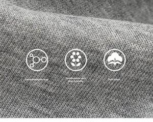 Macro view of soft grey knit cotton fabric showing skin-friendly texture and quality