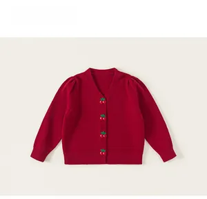 Detailed view of red kids knit cardigan featuring cute 3D cherry buttons and v-neck