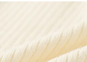 Close-up of cream white ribbed knit fabric texture with soft and fuzzy mohair fiber detail
