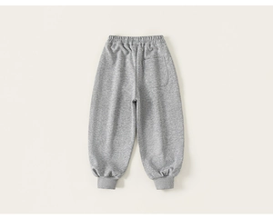 Detail of gray cotton jogger pants showing elastic waistband and back pocket texture