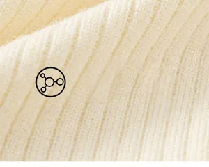 Detailed macro view of soft cream-colored ribbed knit fabric with fluffy texture