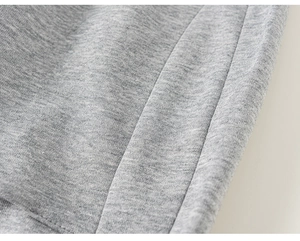 Close-up of gray knitted kids joggers showing high-quality stitching and cotton fabric