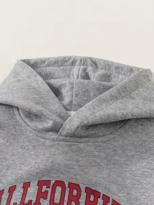 Grey hooded sweatshirt for kids with vintage varsity print and layered neck design