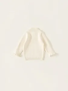 Girl's white ribbed knit sweater with ruffle cuffs and mock neck for autumn wear