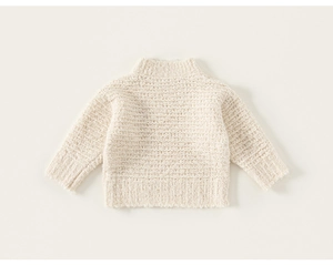 Detail of cream knit sweater showing ribbed high collar and thick textured fabric