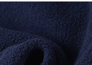 Detailed macro view of soft dark blue polar fleece fabric texture for children sportswear