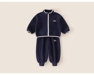 Detail view of dark blue fleece tracksuit for kids with white zipper and stand collar