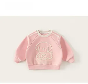 Detail of pink girls' hoodie featuring premium towel-embroidered dog pattern and ribbed cuffs