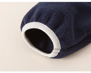 Detailed macro view of dark blue polar fleece sleeve cuff with elastic hem for warmth