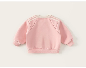 Detail of pink long-sleeved kids sweatshirt with three white stripes on raglan sleeves