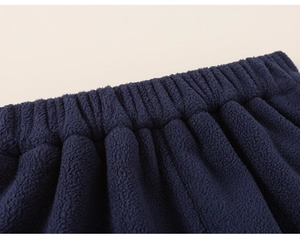 Close-up of elastic waistband on dark blue polar fleece trousers with durable stitching