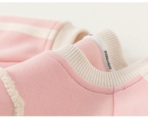 Close-up of pink toddler sweatshirt with ribbed crew neck and soft knitted fabric
