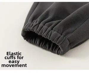 Detail shot of dark grey jogger pants featuring high-quality elasticated ankle cuffs