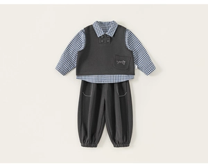 Detailed flat lay of boys' three-piece set with plaid shirt, vest, and trousers