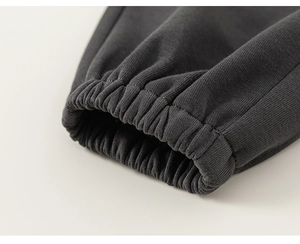 Detail of high-density dark grey knitted cotton elastic cuffs on children's casual wear
