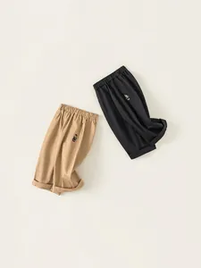 Pantalon décontracté pour enfants en kaki et noir avec broderie ours mignonne