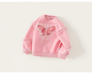 Close-up of pink girls' sweatshirt featuring 3D butterfly embroidery and ruffled sleeves