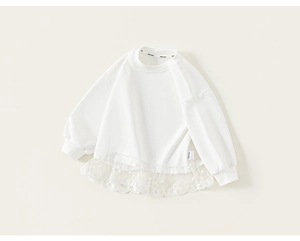 Detailed shot of white cotton kids sweatshirt with delicate floral lace hem and embroidery