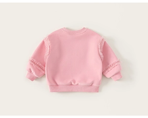 Detail of pink cotton sweatshirt for girls with sweet lace ruffles on sleeves