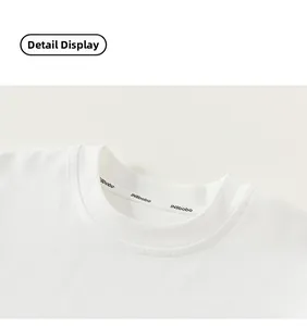 Close-up of white round neck cotton t-shirt collar with neat stitching and printed logo