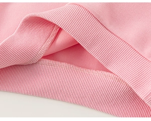 Detail of pink girls sweatshirt showing ribbed cuffs and fine stitching craftsmanship