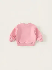 Pink girl's long sleeve sweatshirt featuring sweet tulle ruffle trim on sleeves