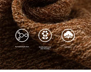 Vue macro montrant la texture épaisse du tricot marron avec fibres douces et saines