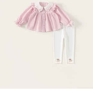 Close-up of pink long-sleeve ruffled collar top and white pants with rabbit embroidery
