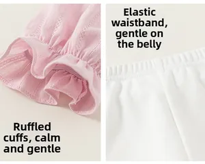 Detail of pink embroidered lace cuffs and elastic waistband on girls cotton set