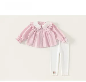 Detail of pink cotton shirt with Peter Pan collar and rabbit embroidery for baby girls