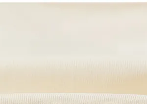 Macro detail of soft cream ribbed knit fabric texture on long sleeve girls t-shirt