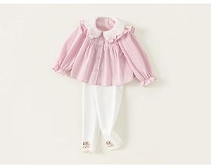 Detail of pink Peter Pan collar with rabbit embroidery and white ruffle trim for girls