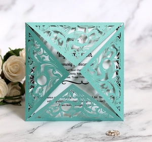 Elegant laser-cut floral wedding invitation in cyan blue with pearl finish and insert card
