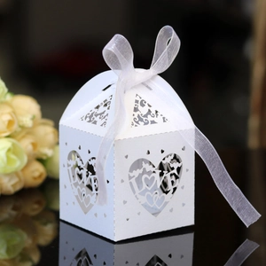 Elegant white laser-cut LOVE heart favor box with organza ribbon for wedding and party