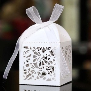 White laser-cut butterfly gift box with floral patterns and white organza ribbon bow