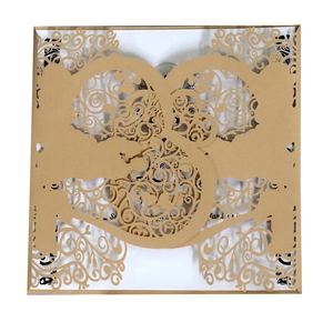 Elegant laser-cut wedding invitation card with intricate vine patterns and golden finish