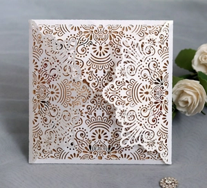Elegant white laser-cut square wedding invitation with mandala lace and kraft inner paper