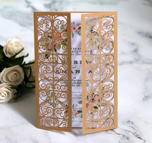 Elegant laser-cut dark red wedding invitation with gold glitter and floral inner card