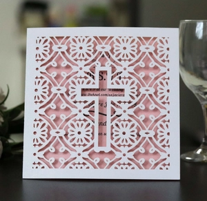 Detailed laser-cut white church wedding invitation card with elegant cross and pink insert