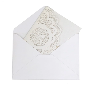 Elegant white laser cut wedding invitation card set with intricate lace heart pattern