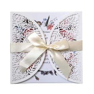 Laser cut floral wedding invitation with pink rose card and elegant silk ribbon bow