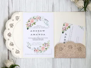 Macro view of laser-cut rose hollow pocket and floral wedding invitation card set