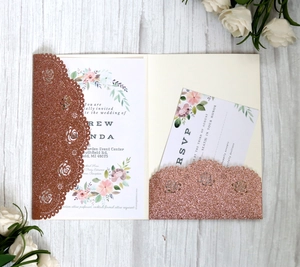 Detail of rose gold glitter laser-cut floral wedding invitation set with RSVP card