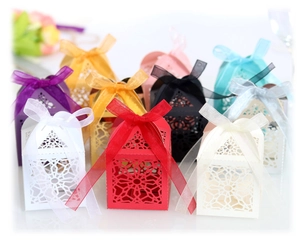 Elegant laser-cut lace candy gift boxes with silk ribbons in multiple vibrant colors