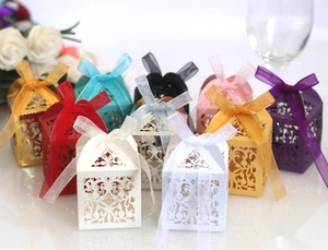 Elegant hollow lace laser cut wedding favor boxes with organza ribbons in various colors