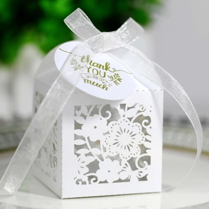 White laser-cut floral wedding gift box with ribbon and Thank You tag for candy storage