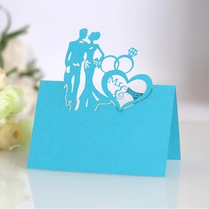 Sky blue laser-cut Mr & Mrs wedding table place cards with heart and ring cutout